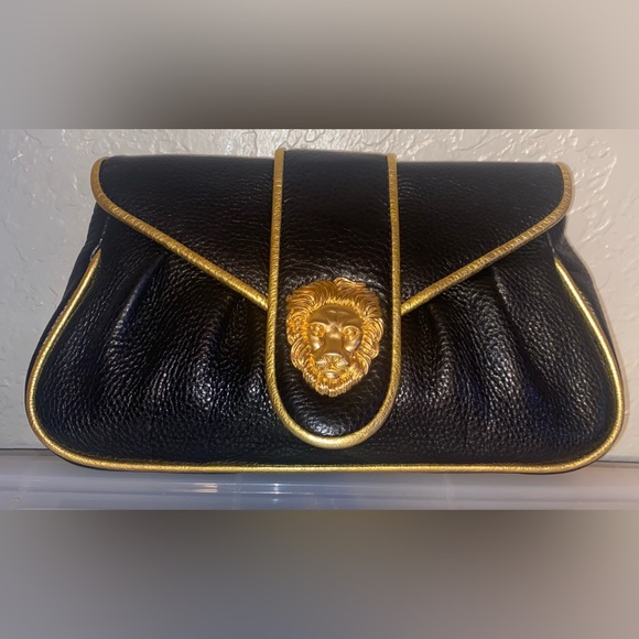 Dooney & Bourke Handbags - DOONEY AND BOURKE HAYDEN PANETTIERE
BLACK LEATHER CLUTCH W/ GOLD TRIM NWT RARE